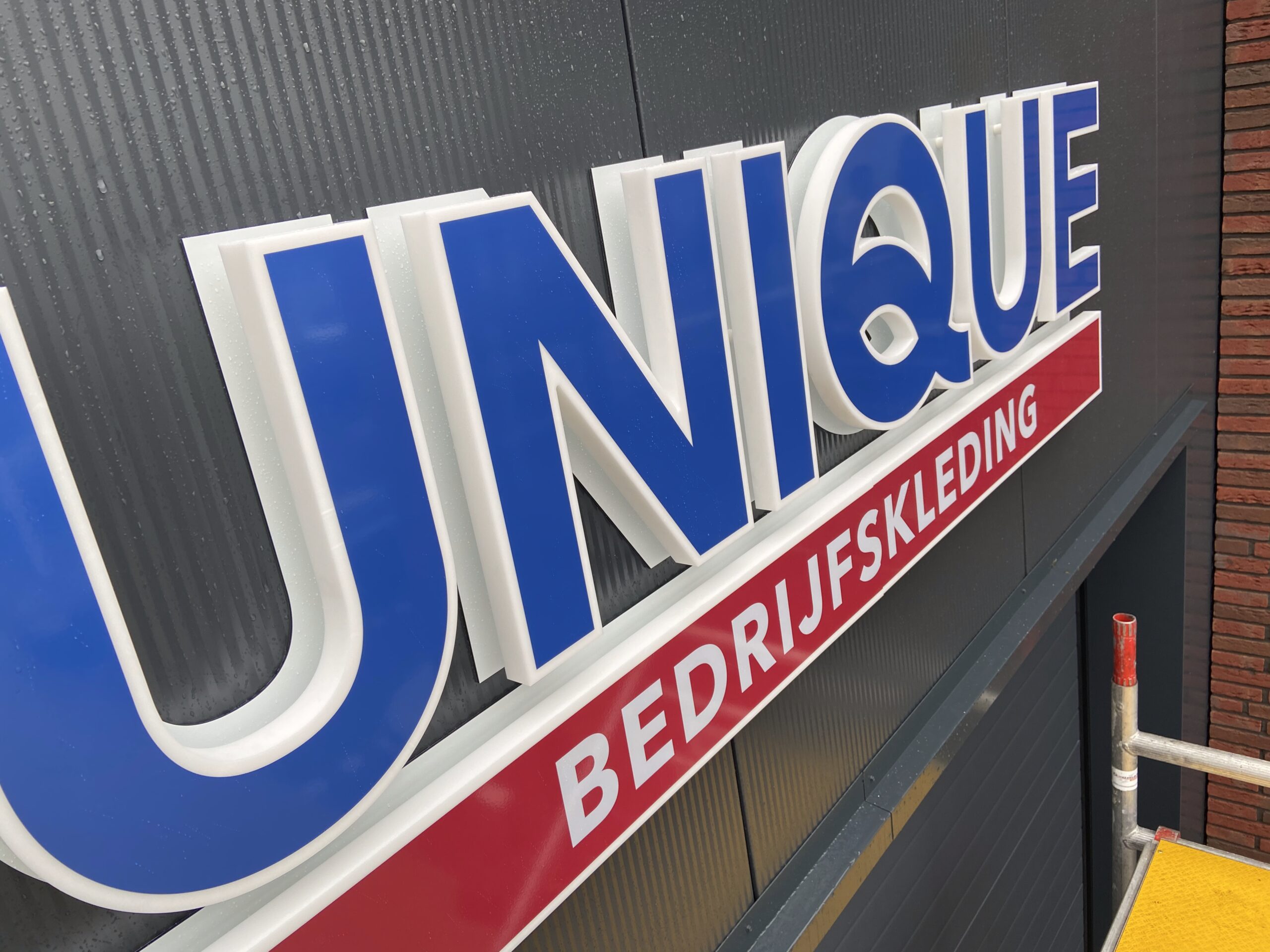 Gevelreclame Unique bedrijfskleding Bodegraven